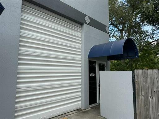 3000 Ravenswood Road, Unit 6A, Dania Beach — street-level roll-up door and unit entry